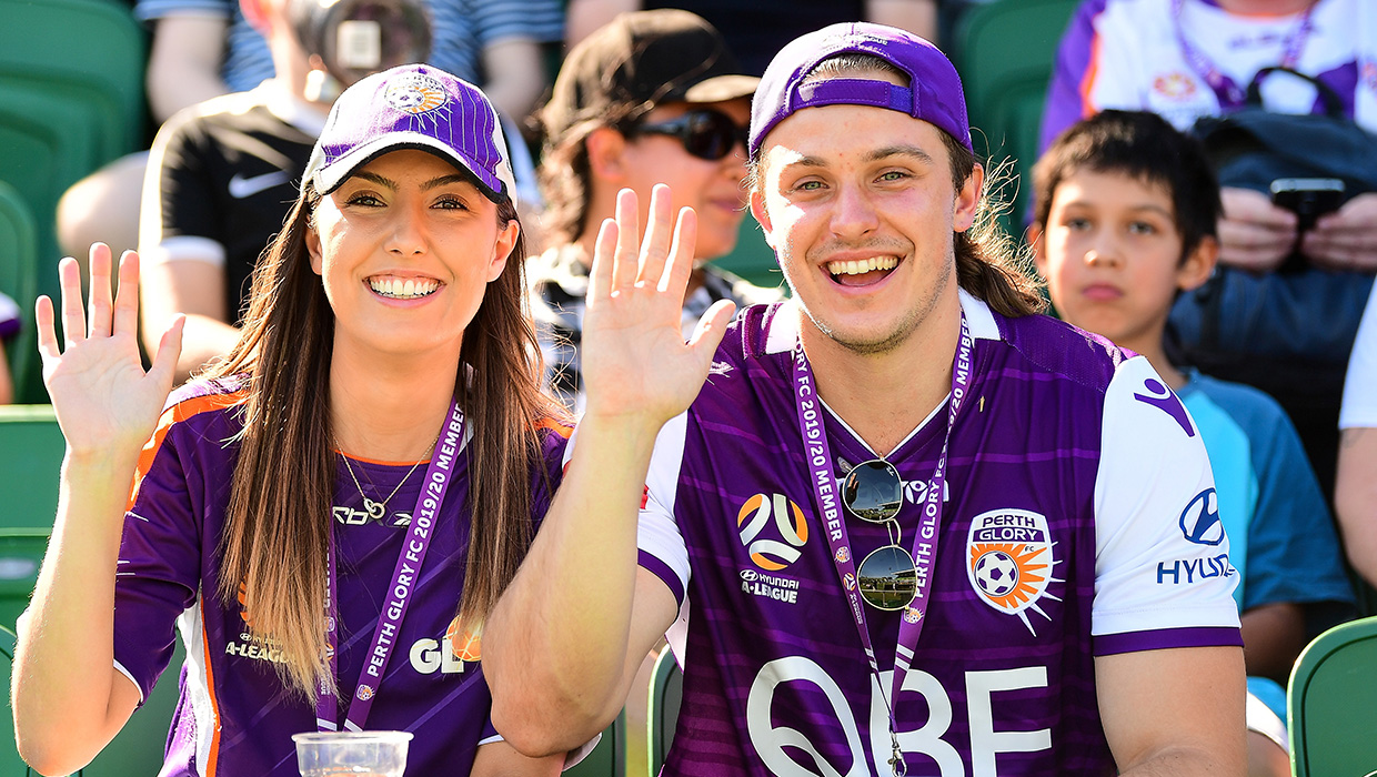Glory v Adelaide - couple watching the game